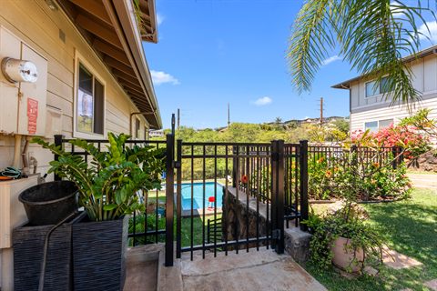 Black aluminum pool fence and self-closing gate, Oahu