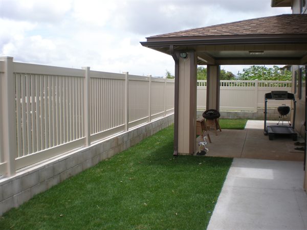 Almond vinyl semi-privacy fence on a block wall, Oahu